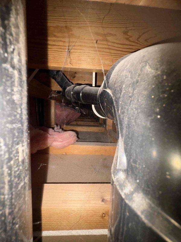 Responded to callback for water saturation in laundry room floor traced to outdoor spigot leak within wall cavity. Replaced defective hose bib assembly and verified proper installation with no active leaks detected at time of inspection. Documented attic/crawl space conditions and interior mechanical equipment showing moisture damage and deteriorated insulation materials for customer awareness.