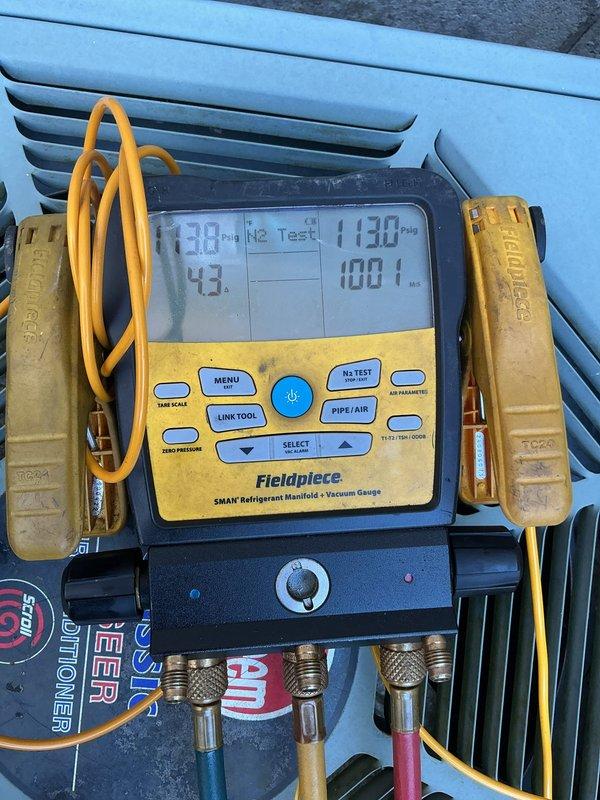Returned to complete charging procedure on A/C system requiring R-22 refrigerant. Performed nitrogen pressure test to 1130 PSIG to verify system integrity and confirm no leaks were present. Upon successful pressure test, evacuated system to proper vacuum levels using professional-grade vacuum pump and digital manifold gauges. Charged system with R-22 refrigerant to manufacturer specifications and verified proper operating pressures and temperatures. Total labor time: 4 hours.