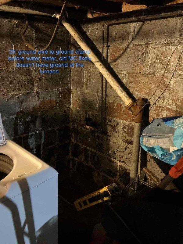 Completed site assessment of residential HVAC system located in basement with walkout access. Documented existing electrical infrastructure including portable breaker box configuration and measured installation space requirements (15' x 35' area). Identified critical electrical grounding deficiency where ground wire requires proper connection to ground clamp before water meter, as existing furnace installation lacks adequate grounding. Observed significant moisture damage and deterioration of concrete block walls in utility space with extensive water staining and efflorescence present. Photographed existing conditions and created detailed floor plan sketch noting crawlspace dimensions, panel placement requirements, and necessary electrical upgrades including wire routing to water main and breaker specifications.