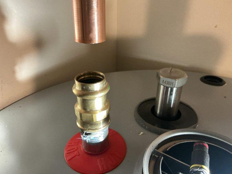 Responded to service call for A.O. Smith tanked water heater with pilot light failure that would not remain lit since the weekend. Upon arrival, inspected the unit and its components, including the thermocouple, gas control valve, and pilot assembly. Previous repairs had been completed on this unit in late October. Performed diagnostic testing on the pilot safety system and evaluated the thermocouple probe and gas control valve operation. Discussed repair options versus replacement with tankless water heater system as an alternative solution given the unit's service history and ongoing reliability concerns. Documented current condition of water heater installation, including copper supply lines, expansion tank, venting system, and safety components. Customer is considering conversion to tankless system for improved efficiency and reliability.