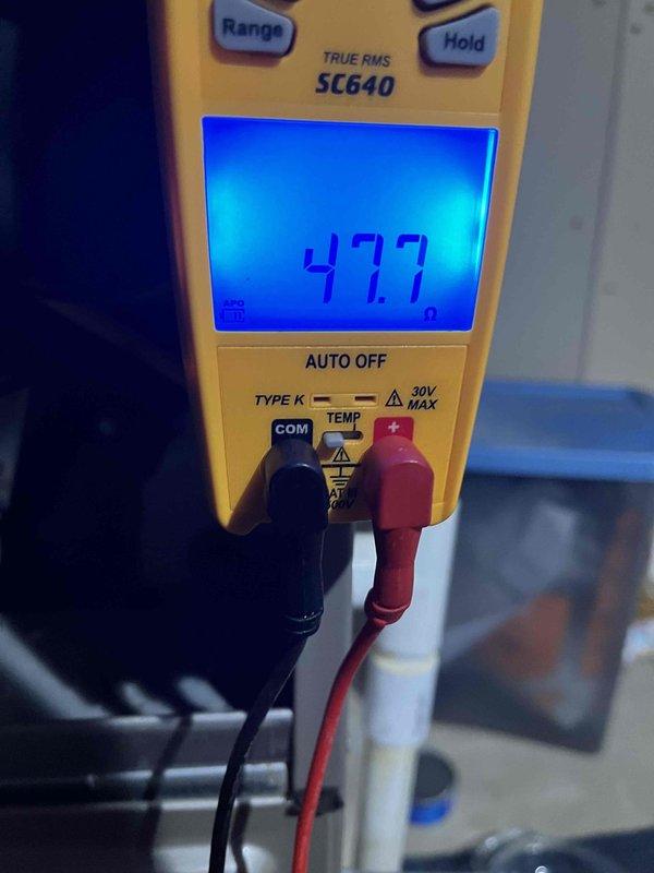 Completed scheduled heating maintenance member visit and performed comprehensive system inspection. Verified thermostat operation showing 71°F current temperature with system in auto mode, and conducted electrical diagnostics using digital multimeter which confirmed proper voltage readings at 47.7 on the heating system components.