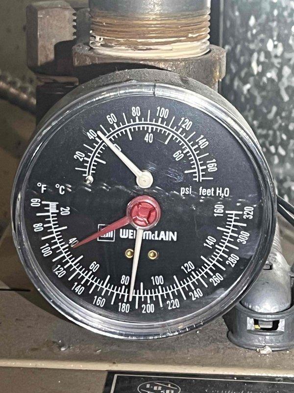 Completed scheduled boiler maintenance and system inspection. Verified proper operation of Weil-McLain boiler system, checked pressure gauge readings and confirmed all measurements were within normal operating parameters. Inspected supply air registers and documented dust accumulation on louvers and grilles, indicating need for routine filter maintenance and air quality attention during future service visits.