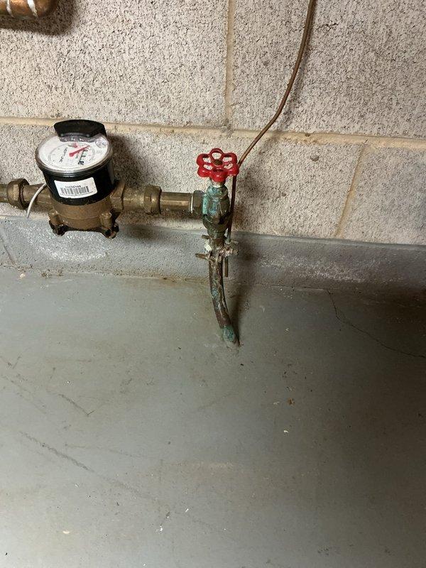 Performed annual heating maintenance on heat pump system installed in 2023, confirming proper operation with no issues identified. Replaced deteriorated copper drain stack with PVC piping to address drainage concerns. Inspected plumbing infrastructure including water meter, main shutoff valve, and water heater connections, noting corrosion on copper piping that was documented for future monitoring.