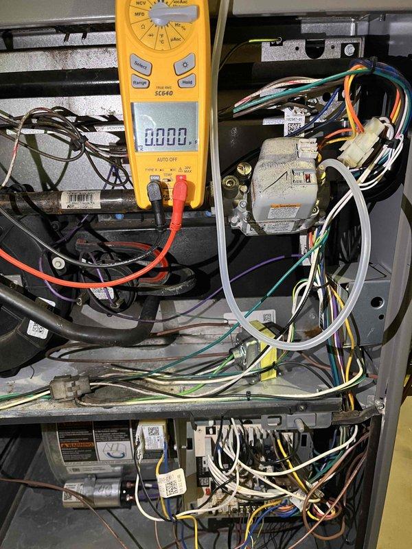Performed seasonal heating maintenance on the gas furnace, including inspection of the furnace cabinet, gas control valve, wiring harnesses, transformer, capacitor, motor, and control board. Verified electrical operation using a true RMS clamp meter, measuring approximately 22.5 amps AC on the monitored circuit. Noted dust and soot accumulation around the gas valve and cabinet interior, and the system was left operating within normal parameters.