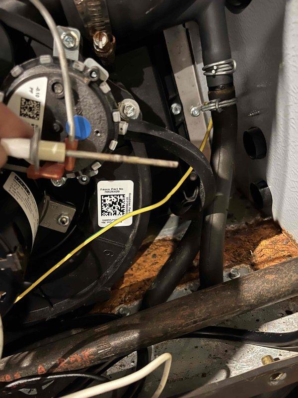 Performed annual heating maintenance, inspecting the furnace interior, inducer motor assembly, flame sensor/igniter, wiring, and vent hoses. Conducted combustion analysis on natural gas, with results within normal operating range: CO 13 ppm, O2 8.5%, CO2 7.01%, and efficiency 94.8%. Noted heavy rust and corrosion on the cabinet base and brackets, which should be monitored and addressed to prevent further deterioration.