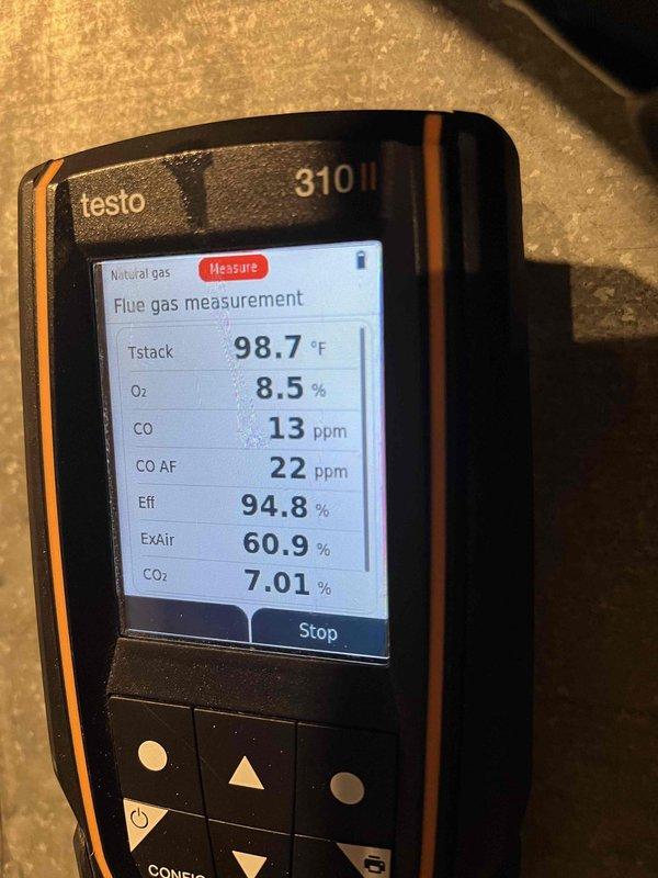 Performed annual heating maintenance, inspecting the furnace interior, inducer motor assembly, flame sensor/igniter, wiring, and vent hoses. Conducted combustion analysis on natural gas, with results within normal operating range: CO 13 ppm, O2 8.5%, CO2 7.01%, and efficiency 94.8%. Noted heavy rust and corrosion on the cabinet base and brackets, which should be monitored and addressed to prevent further deterioration.