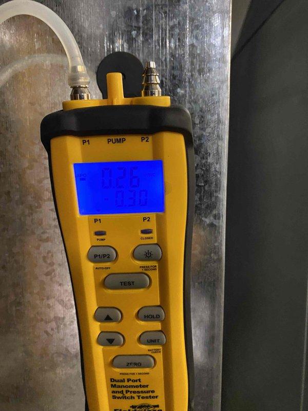 Installed an Amana AMVT variable-speed air handler (2-ton, 15 SEER heat pump system) in the basement utility area, with galvanized supply plenum and transitions connected to the existing ductwork and PVC condensate drain piping with isolation valves routed to the floor drain. Verified static pressure with a dual-port manometer (0.26 IWC supply / -0.30 IWC return) to confirm airflow is within acceptable operating range.
