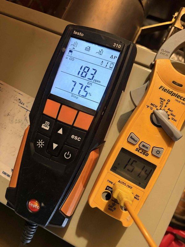 Performed annual boiler maintenance, including a camera scope inspection of the flue/vent and heat exchanger passages to verify they were clear and free of obstruction or deterioration. Conducted a combustion analysis with a Testo 310, recording CO at 183 ppm and combustion efficiency of 77.5%, and verified electrical and temperature readings with a clamp meter. The system was operating within acceptable parameters at completion, with the elevated CO reading noted for continued monitoring.