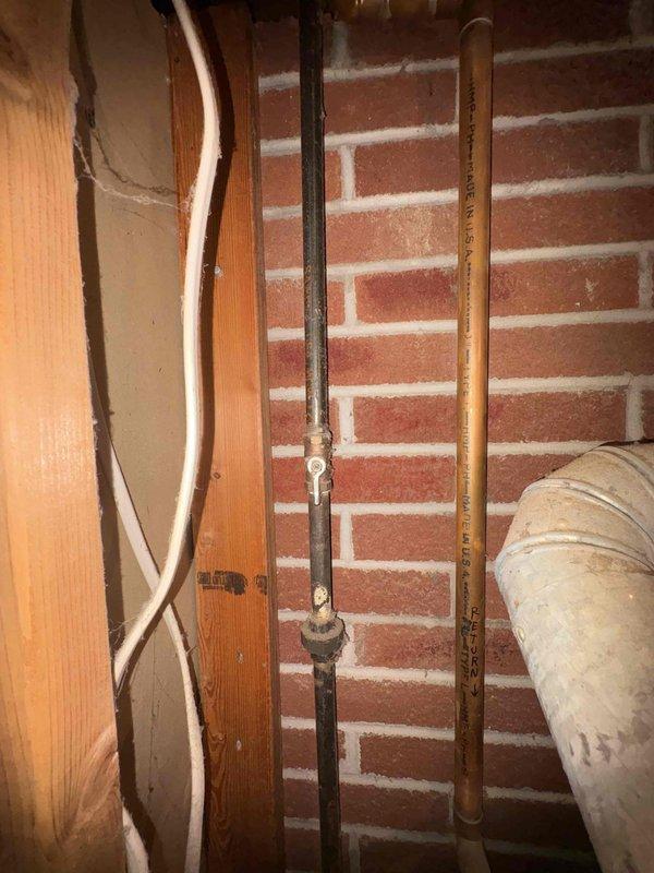 Performed a replacement estimate on a 1987 Weil-McLain boiler with a recurring mercury switch sticking issue, as the homeowner is evaluating whether to keep the unit operating another year. Inspected the open burner compartment, gas controls, wiring, Extrol expansion tank, copper supply/return piping, pressure relief valve, and galvanized flue, and documented typical age-related wear, surface darkening, and dust accumulation with no obvious breakage or leaks. Reviewed repair-versus-replacement options based on the system's age and condition.