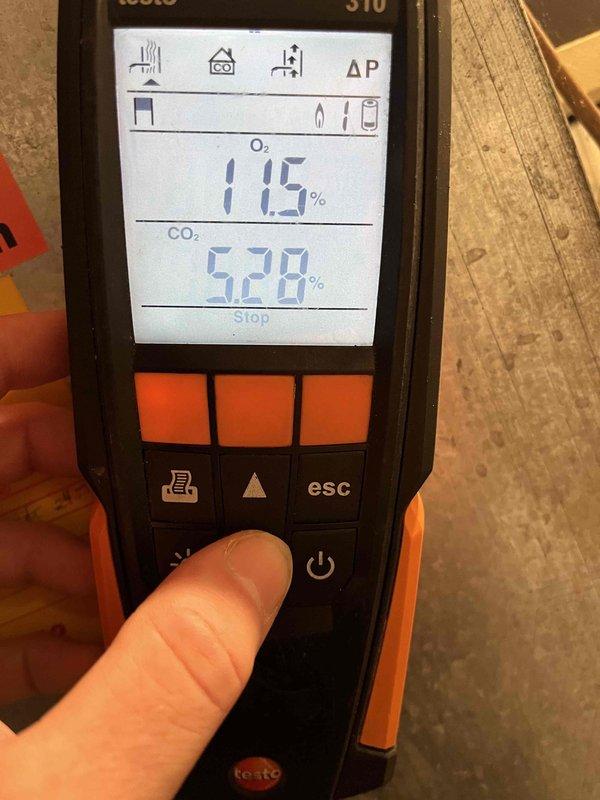 Performed annual heating system maintenance, including a combustion efficiency analysis using a Testo 310 flue gas analyzer. Initial readings showed O₂ at 11.5% and CO₂ at 5.28%; following adjustments, final readings improved to O₂ at 6.7% with combustion efficiency of 84.5%, confirming safe and efficient burner operation within acceptable parameters.