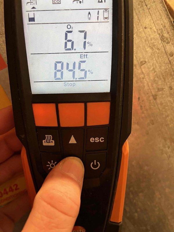 Performed annual heating system maintenance, including a combustion efficiency analysis using a Testo 310 flue gas analyzer. Initial readings showed O₂ at 11.5% and CO₂ at 5.28%; following adjustments, final readings improved to O₂ at 6.7% with combustion efficiency of 84.5%, confirming safe and efficient burner operation within acceptable parameters.