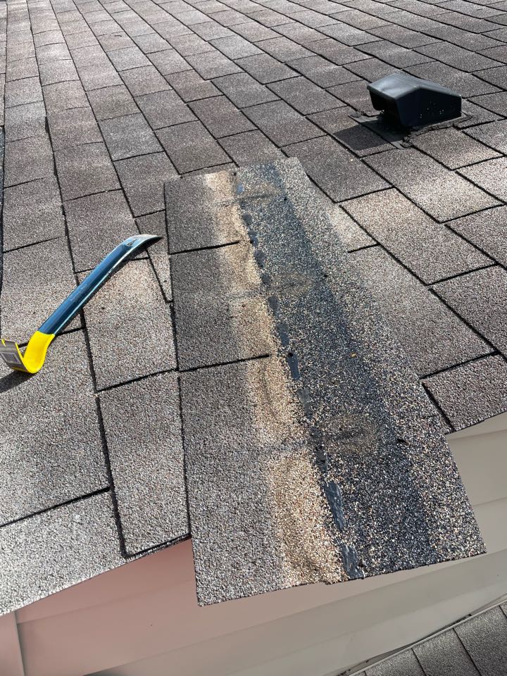 Kent, OH - Taking a shingle off for itel because of wind damage issues Kent, OH - Taking a shingle off for itel because of wind damage issues