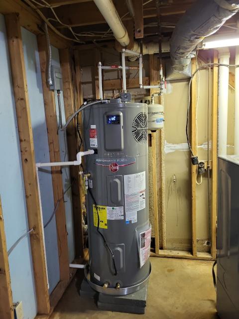 Customer had contacted us for a quote via phone to replace his current GE heat pump water heater that had gone out and stopped working with a new Rheem 50 gallon ProTerra heat pump water heater with leakguard and automatic shut off valve that he had recently purchased from Home Depot. Customer already had the old water heater disconnected. When we arrived today we installed the new customer supplied Rheem 50 gallon ProTerra heat pump water heater with leak guard in basement of home with all necessary water heater code upgrades. We also slightly raised water heater on cap blocks to allow for drain line to exit the exterior of the home.