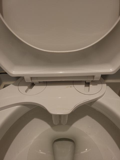 Responded to a call for a clogged toilet in the main bathroom, more than likely due to a piece of the bidet toilet seat breaking off. Once on site, found only toilet was clogged. We performed drain cleaning with a hand auger to clear the blockage. Once blockage was cleared, we installed a new bidet seat that the customer had purchase. 