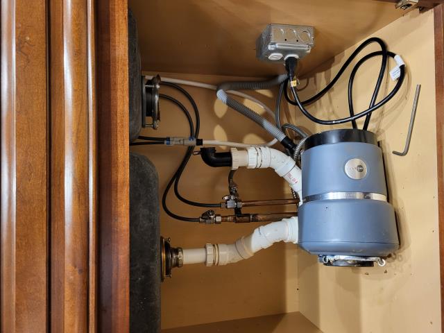 Responded to customer's home because the garbage disposal had fallen off the drain and was laying on the customer's cabinet floor. We found the garbage disposal had come apart from the attachment to the sink. We were able to properly reinstall the garbage disposal to resolve the issue without replumbing or replacing the garbage disposal. While on site, we also evaluated a slow drain in the bathtub. We were able to snake the tub drain to clear the stoppage and resolve all issues. 