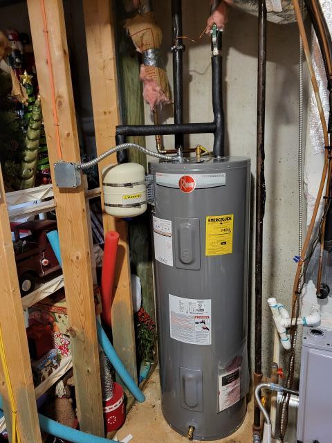 Our customer had contacted us to discuss replacing their current 50 gallon electric water heater. The current water heater is 20 years old. They are also having an issue with no water pressure from the tub faucet. No other faucet in the home is having this issue. After discussing multiple options, we recommended replacing the water heater first before deciding on the faucet repair as replacing the water heater may fix this issue. Since the tub faucet releases the most volume of water, it could simply be that the sediment from the old water heater is causing a blockage on the tub faucet. We arrived today to perform this work. We removed customer's existing water heater and installed a new Rheem 50 gallon electric water heater with a new cold water shut off valve and a new thermal expansion tank. Once the new water heater was installed, the tub faucet was no longer providing little to no pressure, it was working properly as should. 