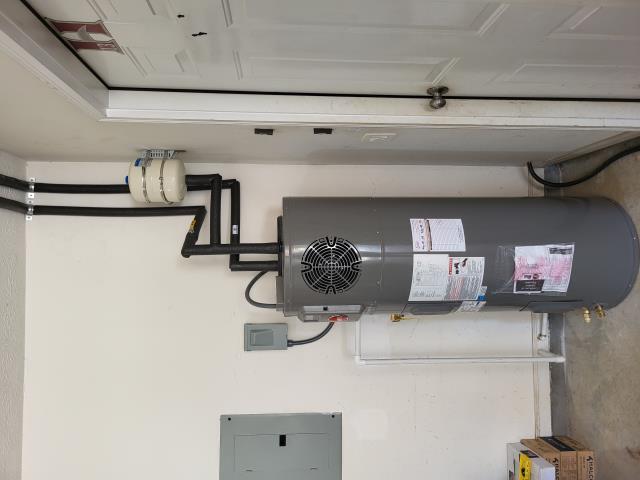 Marietta, GA - We recently visited customer's home and provided him with a quote to convert his current 50 gallon gas water heater with a new electric Rheem ProTerra Hybrid Heat Pump Water Heater as well as relocate the water heater from the upstairs closet to the garage per customer's request. We returned today to perform this work. We removed the current 50 gallon gas water heater and capped the hot and cold water lines as well as the vent line in the upstairs closet. We connected to the water line in the garage and installed new hot and cold water lines to the new location of the heat pump water heater. We installed a new 50 gallon hybrid heat pump water heater with all necessary shut off valves. Marietta, GA - We recently visited customer's home and provided him with a quote to convert his current 50 gallon gas water heater with a new electric Rheem ProTerra Hybrid Heat Pump Water Heater as well as relocate the water heater from the upstairs closet to the garage per customer's request. We returned today to perform this work. We removed the current 50 gallon gas water heater and capped the hot and cold water lines as well as the vent line in the upstairs closet. We connected to the water line in the garage and installed new hot and cold water lines to the new location of the heat pump water heater. We installed a new 50 gallon hybrid heat pump water heater with all necessary shut off valves.