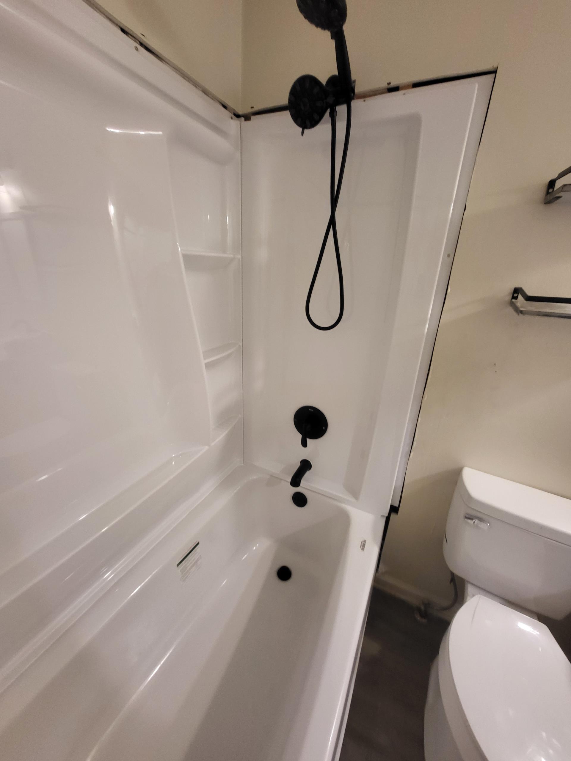 We responded to our customers home to install a customer supplied fiber glass tub with walls surround and tub. We removed the existing one piece tub and shower unit. along with the outdated three handle valve assembly. We installed a new steel tub in place and properly leveled, with a three wall surround installed for durability and function. We upgraded the valves to a modern single handle design to improve ease of use and long term serviceability. All water and drain connections were reconfigured and secured to to meet plumbing standards. Once installation was completed, we tested for leak free operation. No leaks were detected, confirming leak free detection. The work area was cleaned and left in safe condition upon completion.