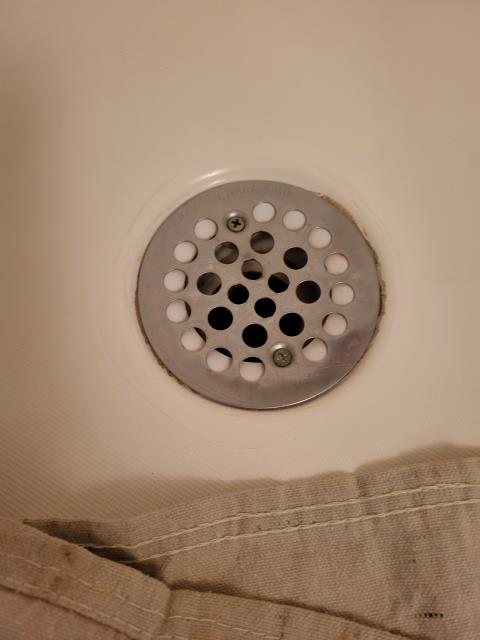 Our customer had contacted us when they noticed their shower drain was leaking around the drain. After evaluation, we determined the old shower drain assembly was worn out and the sealant bond to the drain had broken down over time, allowing water to seep through. We removed the existing shower drain, cleaned off all the old caulk and sealant and resealed with new caulking to resolve shower drain leak issue.