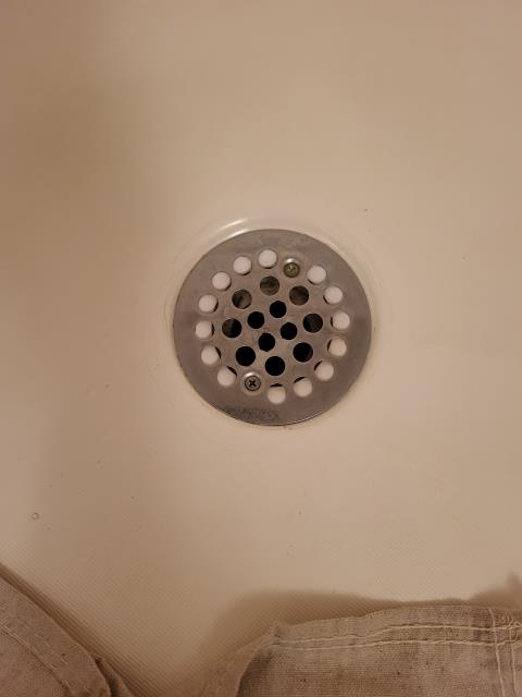 Our customer had contacted us when they noticed their shower drain was leaking around the drain. After evaluation, we determined the old shower drain assembly was worn out and the sealant bond to the drain had broken down over time, allowing water to seep through. We removed the existing shower drain, cleaned off all the old caulk and sealant and resealed with new caulking to resolve shower drain leak issue.