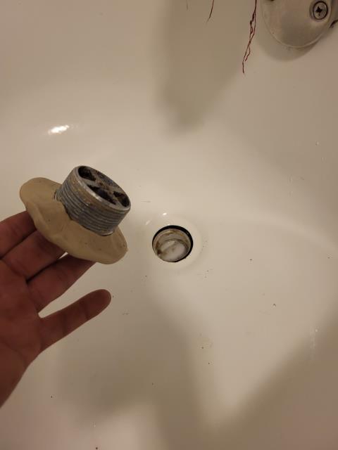 We were called out after our customer noticed water leaking through the kitchen ceiling whenever the upstairs bathtub was used. Once onsite, we ran the water in the upstairs tub to confirm if this could be causing the leak. After inspection, we confirmed water was dripping from above. We cut open the sheetrock ceiling and found that the tub shoe fitting under the upstairs tub was leaking. We removed the damaged fitting and repaired the leaking tub shoe. After the repair was complete, we ran the bathtub multiple times to test for leak free operation. 