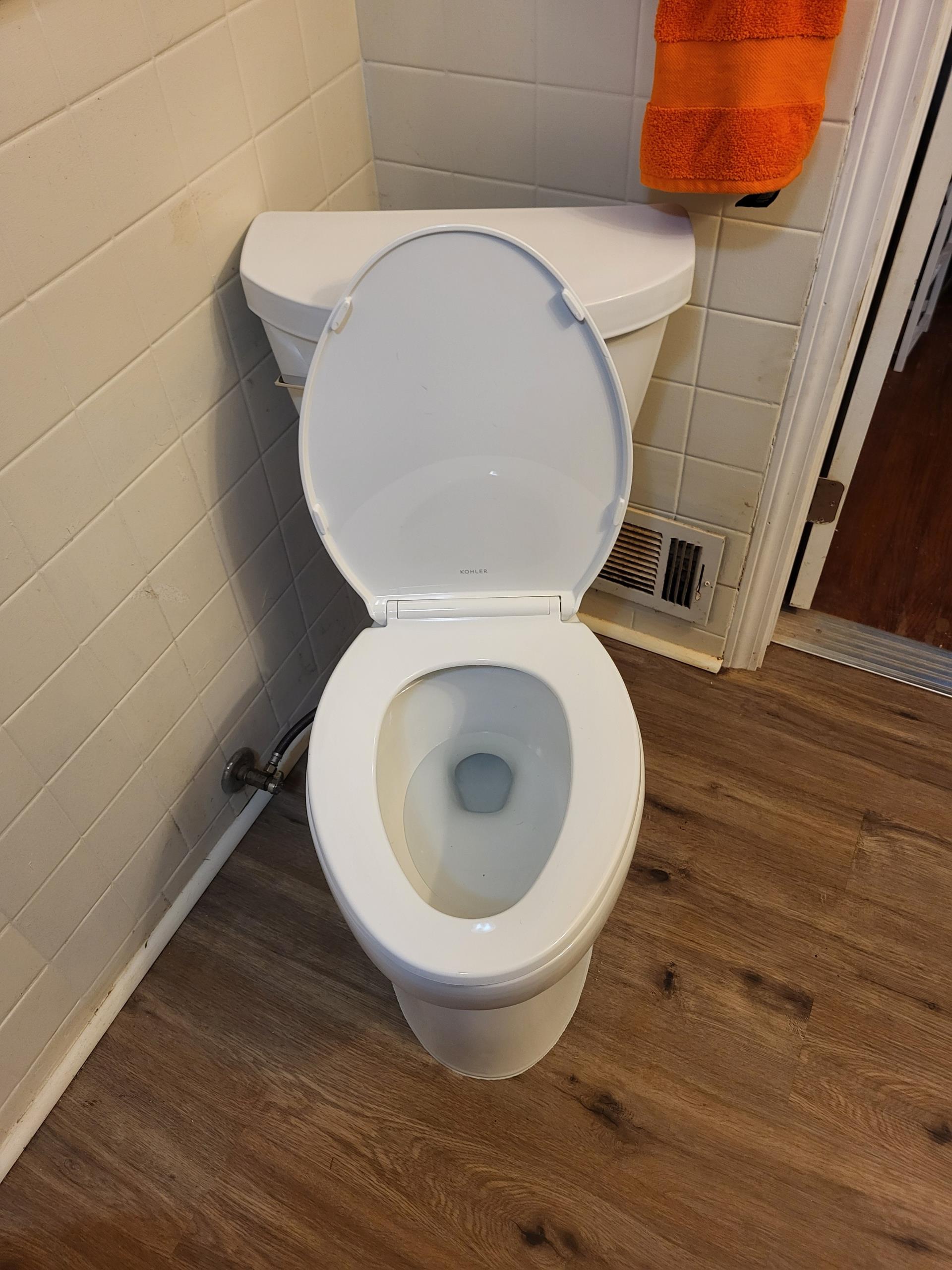 We were called out to replace our customers toilet that has a crack in the porcelain, which was causing a slow leak around the base. We removed the old toilet and inspected the flange and drain connection to ensure they were in good condition for the new installation. We installed a new wax ring seal then set and secured a new Kohler Cimarron toilet in its place. After reconnecting the water supply line, we turned the water back on and tested for leak free operation.
