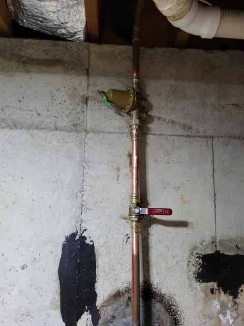 We responded to our customer due to replacing the main shut off valve and the pressure reducing valve (PRV) located in the basement. The existing valves were worn and no longer sealing properly, which can cause pressure issues and make it difficult to turn the water off during maintenance or emergencies. Once on site, we removed the old main shut off valve and PRV located in the basement then installed a brand new shut off valve and PRV. After completing replacements, we turned the water back on and tested for leak free operation. During our visit, we discovered that the main water line feeding the home was also leaking in the yard. We dug to expose the the damaged section of the pipe, made the necessary repair, and reconnected the line. Once all work was completed, we restored water and verified proper pressure and leak free operation. 