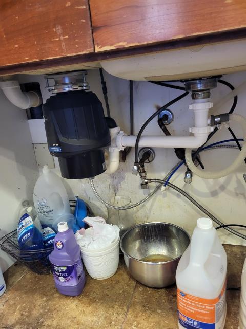 We responded to our customer when they noticed signs of a possible garbage disposal leak underneath kitchen sink . Upon arrival, to locate the source, we ran water through the line and inspected all visible plumbing connections. During our inspection, we found that the washer on a PVC pipe fitting had deteriorated and was no longer sealing the joint properly. We removed the old worn down washer and replaced it with a brand one. After completing the repair, we ran a full water test to check for nay additional leaks or drips.