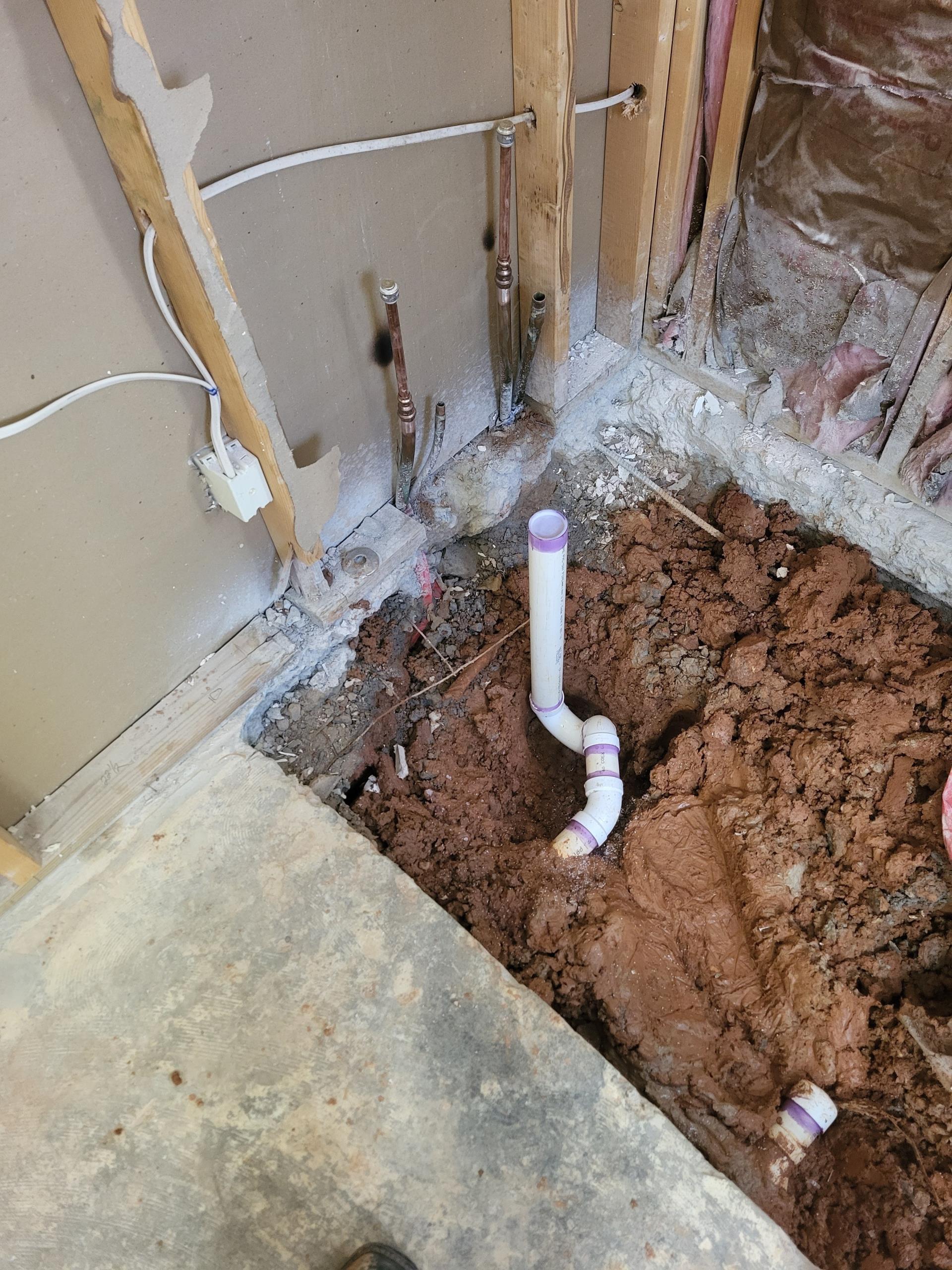 We responded to our customers home to complete a full plumbing rough in as part of their bathroom remodel, which required relocating several fixtures to fit the new layout. Once on site, we began by removing the existing lavatory and rerouting the drain and supply lines approximately two feet to match the new vanity location. We then relocate the shower drain and repositioned the P-trap so it would properly line up with the new shower base. The toilet rough in also needed to be shifted about six feet to accommodate the redesigned floor plan, so we installed the closet bend piping and secured the new flange location. All drain, waste, and vent connection were fitted, glued, and checked for proper alignment. Once the rough in adjustments were complete, we pressurized the supply lines and ran water through the drains to verify leak free operation. 