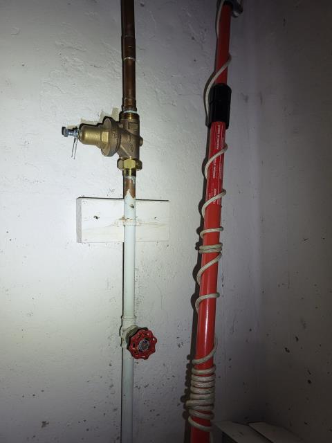 We responded to our customers home to address issues with the main water line supply and aging valves in the basement. After evaluating the plumbing system, we found that the existing pressure reducing valve (PRV) and the main shut off valve were no longer operating reliably. We removed the old components and installed a new PRV and shut off valve to restore proper water pressure control and dependable isolation of the homes water supply. We also inspected the nearby expansion tank and determined it had failed, so we replaced it with a properly sized new unit to help regulate thermal expansion within the plumbing system. In addition, we replaced a worn off shut off valve for the exterior hose bibb to ensure smooth operation and prevent future leaks. Once all installations were complete, we pressurized the system and verified leak free operation throughout the home.
