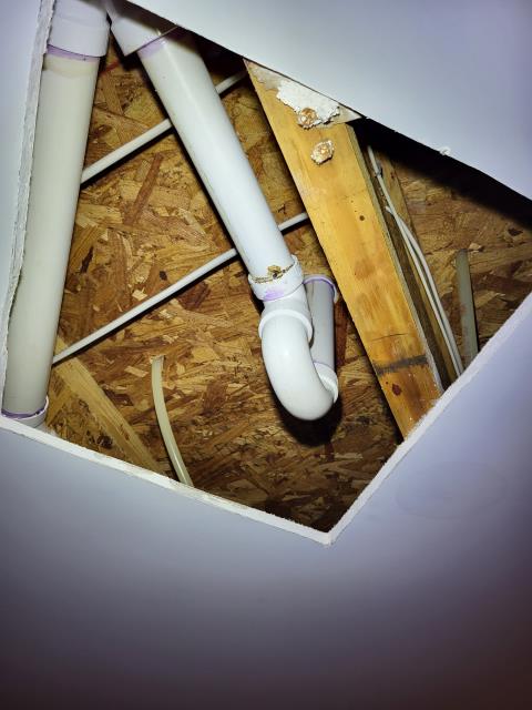 Our customer contacted us after noticing a water leak coming through the sheetrock ceiling below their upstairs bathtub. Upon inspection, we found that the existing PVC tub trap had not been glued during the original  installation, causing it to come loose and leak over time. We removed the faulty trap and installed a new, properly sealed PVC trap to prevent any future issues. After completing the repair, we tested the drain system to confirm leak-free operation. The ceiling leak has now been resolved and the bathtub is functioning as it should.
