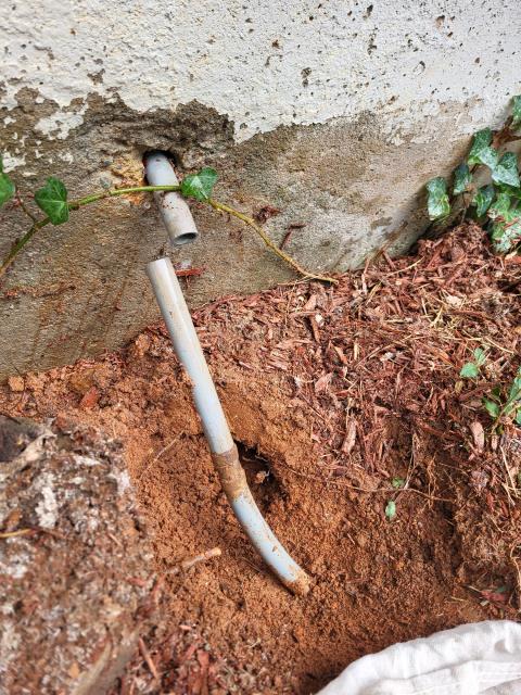 We responded to our customers home after a leak was discovered in the main water line at the foundation wall. Once on site, we inspected the area and confirmed the pipe was leaking where it passed through the concrete. We shut off the main water supply and cut out the damaged section of the pipe going through the foundation. A new section of water line was installed and securely reconnected to restore proper flow. After completing the repair, we turned the water back on and tested the line to ensure it was leak free. To finish the job, we sealed the foundation penetration with hydraulic cement to help prevent future water intrusion.