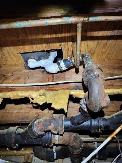 We responded to our customers home to repair a leaking cast iron drain line serving the kitchen and laundry room. Upon inspection, we found the existing cast iron piping was deteriorated and actively leaking. To resolve the issue, we removed the damaged cast iron drain line. We then installed new PVC drain piping to provide reliable drainage and prevent future leaks. A new drain line was also brought up into kitchen cabinet to properly serve the kitchen sink. All connections were secured and aligned to ensure proper flow. The new drain system is now functioning correctly.