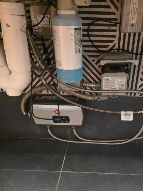 We responded to our customer to a service call for insufficient hot water at the sinks in both the men's and women's bathrooms. Upon arrival, we found the existing InstaHot units were no longer heating water effectively. To restore proper hot water availability, we removed the old units and installed new InstaHot water dispensers. All water supply and electrical connections were made according to manufacturer specifications. Once installations were complete, we powered on the new units and allowed them to reach operating temperature. We tested each sink to confirm consistent hot water delivery. Both bathrooms now have reliable hot water and the new InstaHot units are functioning as designed. 