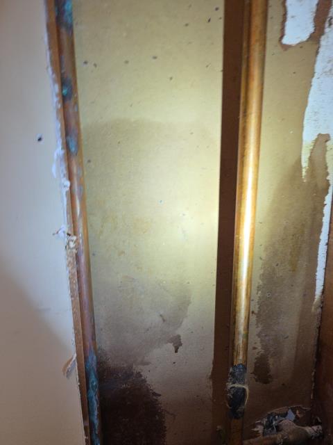 We responded to our customer after they noticed water leaking around the water heater. Upon inspection, we found a pinhole leak in the copper piping located behind the water heater. The water supply was shut off to prevent further damage while the affected section of pipe was accessed. We repaired the damaged copper line using proper fittings and secure connections. Once the repair was completed, the water was turned back on and the line was fully pressurized. We inspected the repaired area and surrounding piping to confirm leak-free operation. The system is now functioning properly with no signs of additional leaks.