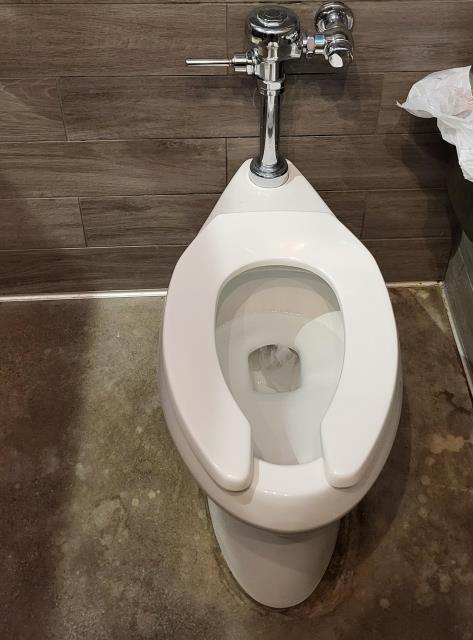 We responded to our customers commercial business to service the women's restroom due to issues with with the toilet not flushing properly and continuously running. Upon inspection, we found the Sloan flush valve was worn and no longer operating as designed. We repaired the flush valve by replacing the necessary internal components to restore proper flushing function. All parts were reassembled and tightened according to manufacturer specifications. Once the repair was completed, we cycled the flush valve multiple times to verify proper operation. We also inspected all connections to ensure there were no leaks present. The toilet is now functioning efficiently and operating leak free. 