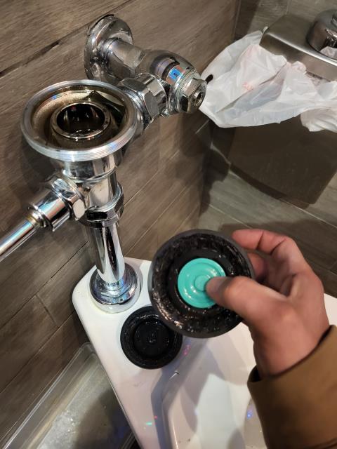 We responded to our customers commercial business to service the women's restroom due to issues with with the toilet not flushing properly and continuously running. Upon inspection, we found the Sloan flush valve was worn and no longer operating as designed. We repaired the flush valve by replacing the necessary internal components to restore proper flushing function. All parts were reassembled and tightened according to manufacturer specifications. Once the repair was completed, we cycled the flush valve multiple times to verify proper operation. We also inspected all connections to ensure there were no leaks present. The toilet is now functioning efficiently and operating leak free. 