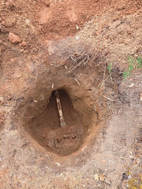 We responded to our customers County Club after they reported difficulty accessing and operating the existing curb stop in front of the clubhouse, near the stairs to the right of the main entrance. The previous curb stop had become buried by landscaping and soil, making it hard to locate and use during maintenance or in an emergency. To correct this issue, we replaced the two inch curb stop to ensure reliable shut off control for the building. Due to nearby irrigation and electrical lines, the area had to be hand dug approximately five feet deep to access the valve. Once the new curb stop was installed, we added an adjustable valve box cover to improve long term accessibility. The valve box was set slightly above the surrounding landscaping to prevent dirt from falling in and covering the the curb stop again. This upgrade ensures the valve remains accessible and functional for future service needs or emergencies.   