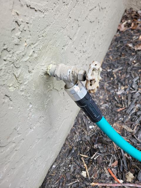 We responded to our customer due to a leak coming from the handle of the front hose bibb when it was turned on.  Upon inspection, we found the packing nut was loose, so we tightened it, which immediately stopped the leak. While on site, we also inspected the gas line in the crawl space and confirmed it appears to be properly installed and secure. We pulled out the electric fireplace to confirm that the gas line behind it was capped off. Additionally, we inspected the guest bathroom lavatory to the left of the front door and found the hot and cold stems were installed incorrectly, causing the handle to turn the wrong direction. We removed and replaced the stem with the correct one for intended operation. Once all repairs were completed, we tested everything to ensure intended use and leak free operation.  
