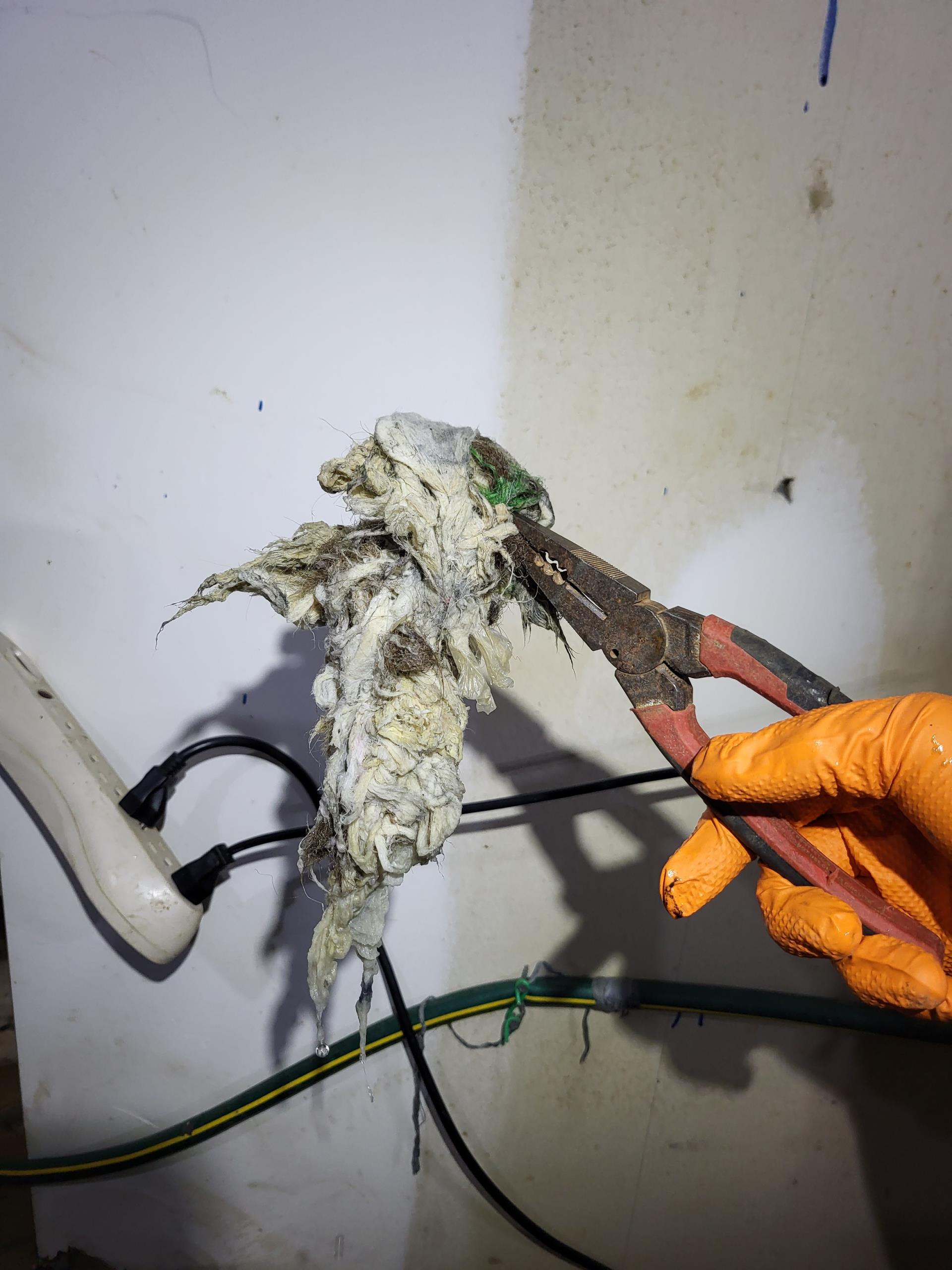 We responded to our customer after they reported that their basement toilet was not flushing properly. Upon arrival, we inspected the sewer ejector pump and found that it was buzzing but not pumping water out as it should. We removed the ejector pump lid and discovered a large clump of debris clogging the pump and preventing it from operating correctly. We then removed the blockage, and reassembled he pump and secured it. Once everything was back in place, we tested the system to ensure proper function and tested for leak free operation. The pump is now operating as intended.