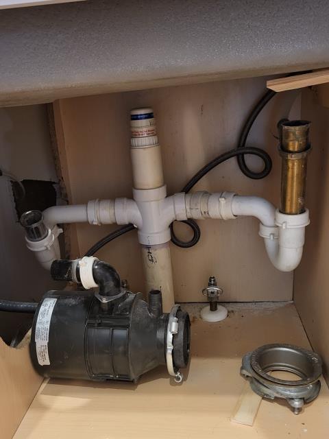 We responded to our customer to install a new kitchen faucet and garbage disposal as well as reconfigure the existing drain lines due to the existing fixtures being outdated and not functioning properly. Once on site, we removed the old components and mounted the new kitchen faucet and connected the water supply lines. We then installed the new disposal and ensured it was properly aligned and supported. The drain piping was reworked to create correct flow, proper slope, and a secure connection to the disposal. All fittings and connections were tightened and sealed to prevent future leaks. Once the installation was completed, we ran water through the system and tested the faucet, disposal and drain lines. Everything is now operating properly and is leak free.