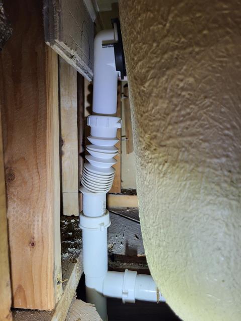 We responded to our customers home after they reported a water leak in the ceiling, with a jet tub located above the affected area. Upon arrival, we noted there was already an opening in the sheetrock below the hallway bathtub, which allowed access for inspection. We removed the access panel and found that the overflow pipe on the tub was not connected, allowing water to leak whenever the tub was filled or used. The slip nut was present but had not been secured properly. We reconnected the overflow pipe using the existing slip nut and ensured the connection was tight and properly aligned. Once secured, we tested the tub to confirm the leak was resolved. After verifying proper operation, we reinstalled the access panel.  