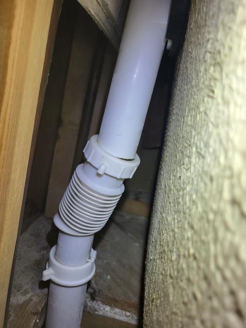 We responded to our customers home after they reported a water leak in the ceiling, with a jet tub located above the affected area. Upon arrival, we noted there was already an opening in the sheetrock below the hallway bathtub, which allowed access for inspection. We removed the access panel and found that the overflow pipe on the tub was not connected, allowing water to leak whenever the tub was filled or used. The slip nut was present but had not been secured properly. We reconnected the overflow pipe using the existing slip nut and ensured the connection was tight and properly aligned. Once secured, we tested the tub to confirm the leak was resolved. After verifying proper operation, we reinstalled the access panel.  