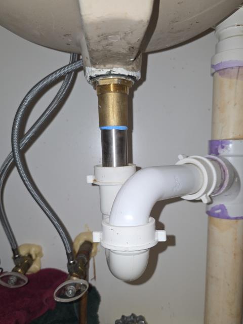 We responded to our customer in Temple, GA after they reported a leak under the lavatory sink. Upon inspection, we found the pop-up drain assembly was leaking inside the cabinet. We removed the faulty pop up assembly and installed a new replacement to restore a proper seal. After completing the repair, we ran water and tested the sink for leak free operation. The bathroom sink is now functioning properly with no leaks.