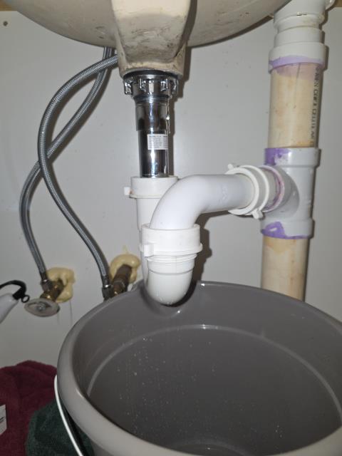 We responded to our customer in Temple, GA after they reported a leak under the lavatory sink. Upon inspection, we found the pop-up drain assembly was leaking inside the cabinet. We removed the faulty pop up assembly and installed a new replacement to restore a proper seal. After completing the repair, we ran water and tested the sink for leak free operation. The bathroom sink is now functioning properly with no leaks.