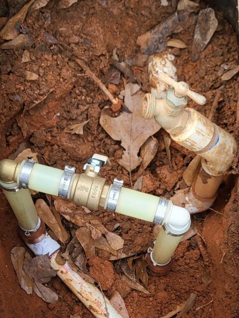 We responded to our customer in Temple, GA after a PVC ball valve broke underground, causing a water leak. We excavated the area to access the damaged valve and raised the connection for better accessibility. We then installed a new brass ball valve for improved durability and long term reliability. Once the installation was completed, we restored water service and tested for proper, leak free operation.