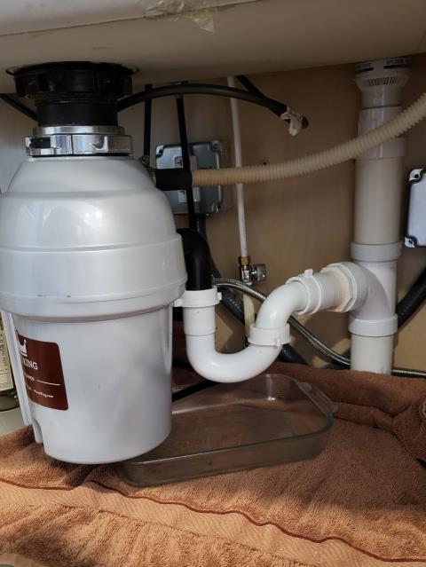 We responded to our customer in Marietta, GA after they reported a leak under the kitchen sink from the garbage disposal. Upon inspection, we found the disposal arm was broken, causing the leak inside the cabinet. We replaced the damaged component to restore a proper seal and function. After completing the repair, we ran water and tested for leak free operation. The garbage disposal is now functioning correctly with no leaks.