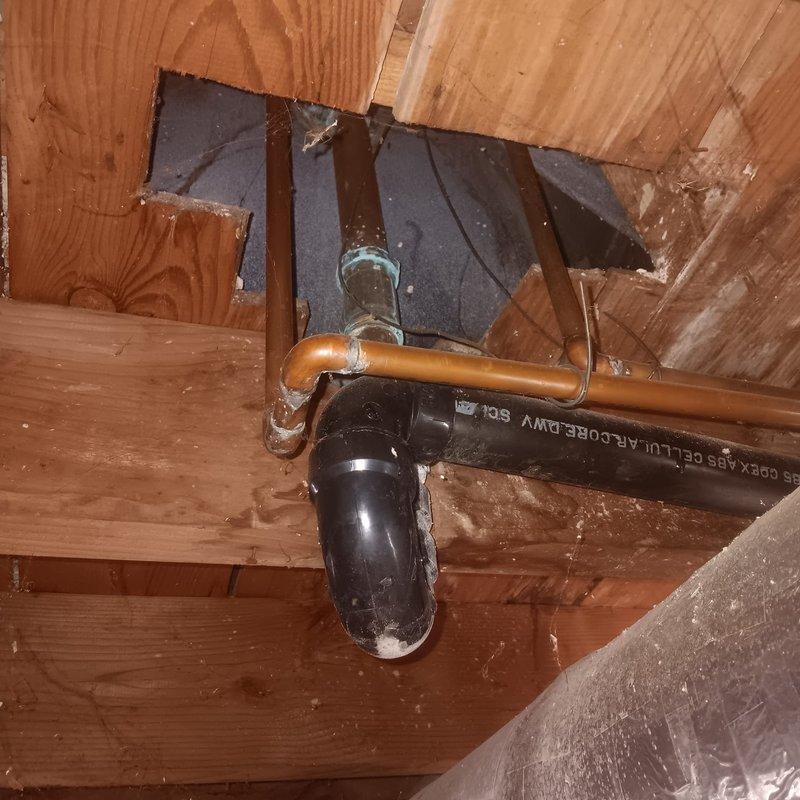 Conducted inspection of client's kitchen and bathroom plumbing systems. Identified severe rust deterioration on main water supply pipe requiring replacement, and examined ABS drain pipe with P-trap installation in wall cavity. Provided comprehensive estimate for necessary repairs and replacement of damaged components.