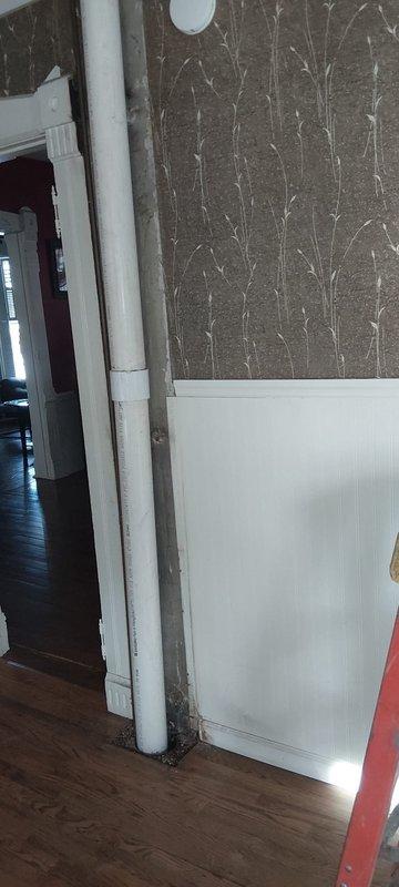 Successfully replaced 4-inch drain line in the wall, extending from the joint in basement above heat duct to upstairs above drop ceiling. Installed new PVC piping with proper fittings, including cutting at the street tee in ceiling as specified. Work completed per service order with customer to handle reinstallation of wood molding covering soil stack.