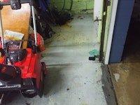 Responded to service call for leaking main valve in customer's garage/utility area. Inspected the valve assembly which showed signs of corrosion and mineral buildup. Successfully repaired the leaking valve by replacing worn components and also cleared blocked drain line using snake equipment as requested.